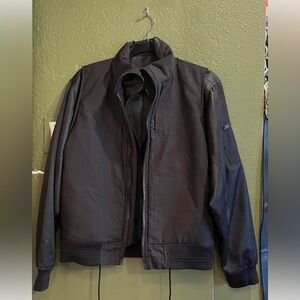 Kith black jacket small. Can be worn in two separate styles super cool